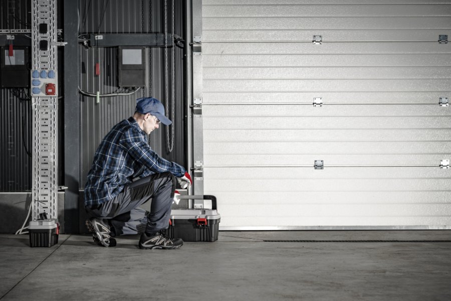 Technician installing a new garage door in Jacksonville, FL